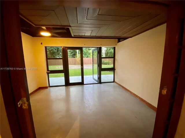 unfurnished room with french doors