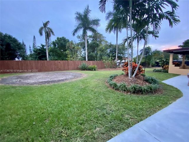 view of yard at dusk