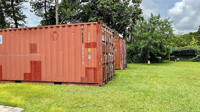 view of outdoor structure with a lawn