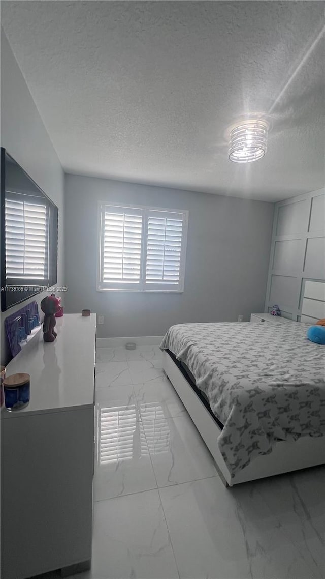 bedroom with a textured ceiling