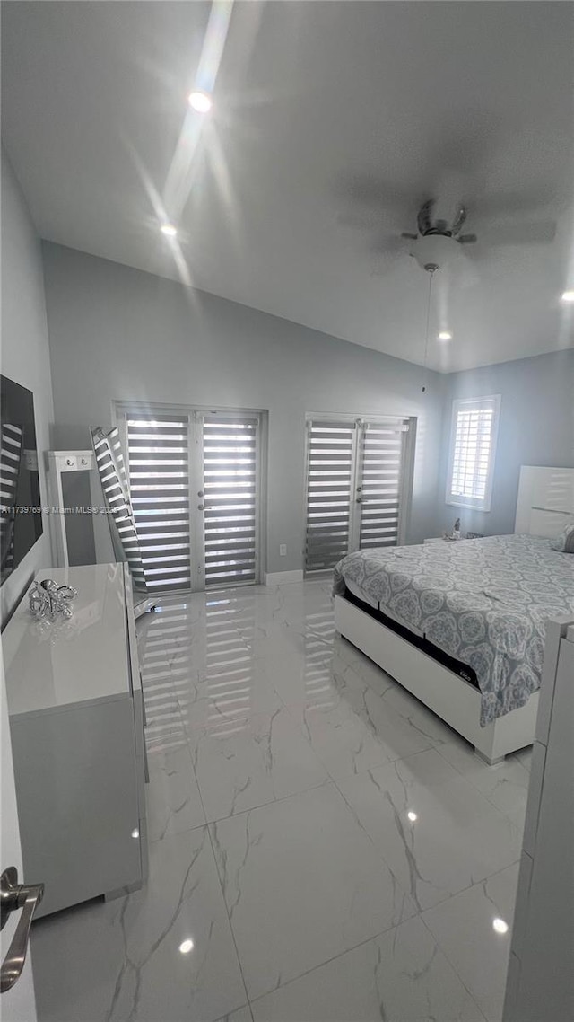 bedroom with lofted ceiling and ceiling fan