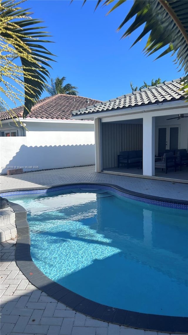 view of swimming pool with a patio