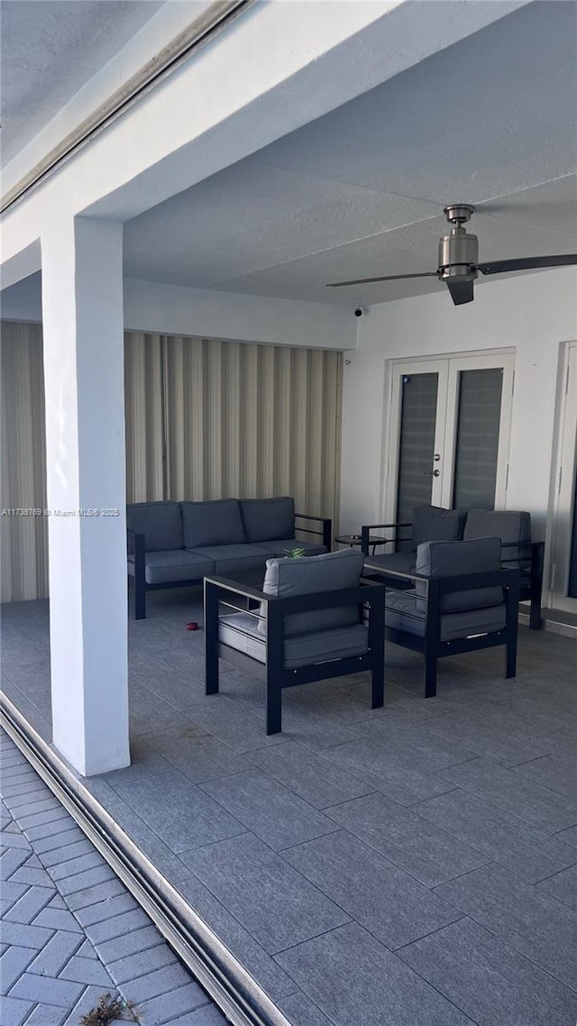 view of patio featuring an outdoor living space and ceiling fan