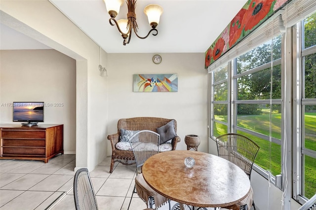 interior space with an inviting chandelier and a healthy amount of sunlight