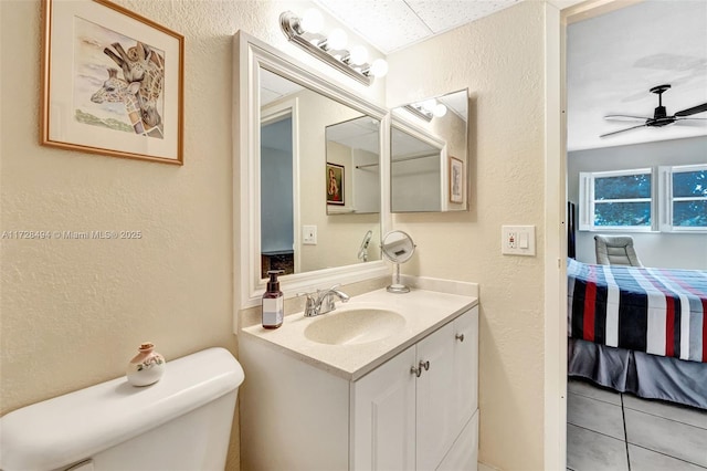 bathroom with vanity, ceiling fan, and toilet