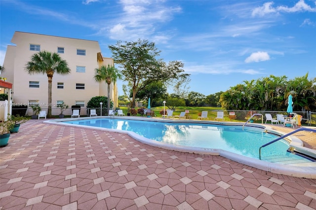 view of pool featuring a patio area