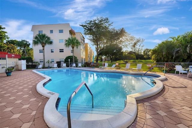 view of swimming pool with a patio area