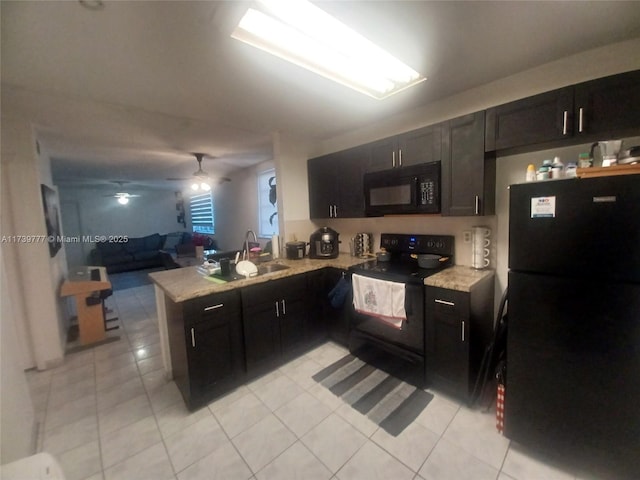 kitchen featuring black appliances, sink, light tile patterned floors, kitchen peninsula, and light stone countertops