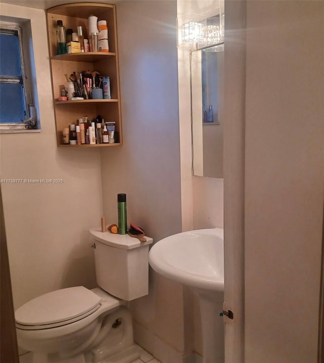 bathroom featuring toilet