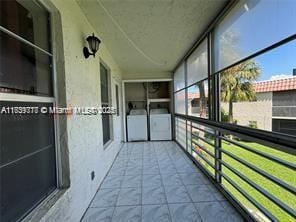 balcony with separate washer and dryer