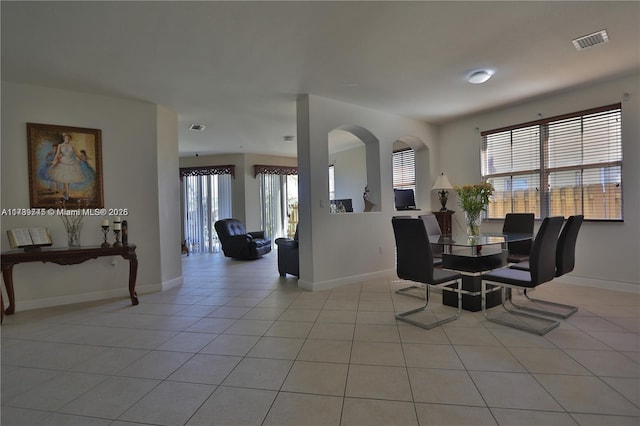 dining area with light tile patterned floors