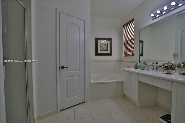 bathroom with tile patterned flooring, vanity, and separate shower and tub