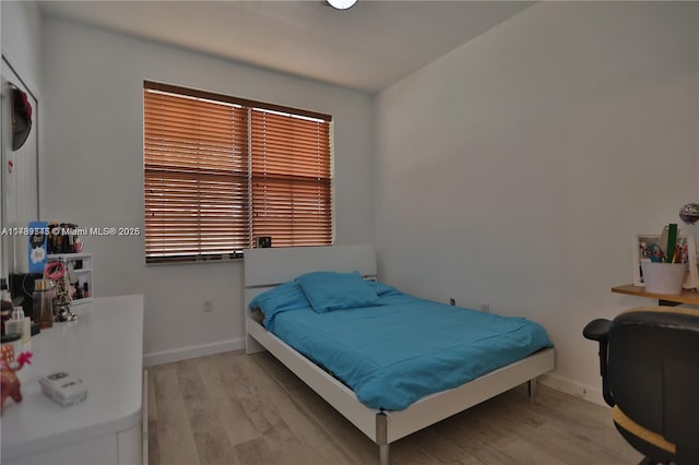 bedroom with light hardwood / wood-style floors