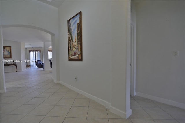 corridor featuring light tile patterned flooring