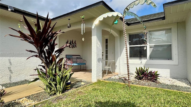 doorway to property featuring a patio