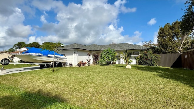 view of front of house with a garage and a front yard