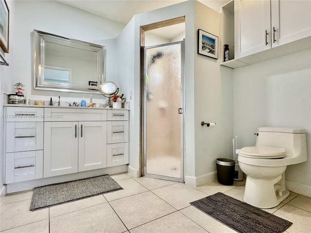 bathroom with toilet, a stall shower, tile patterned flooring, baseboards, and vanity