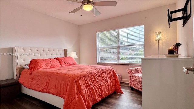 bedroom featuring a ceiling fan and wood finished floors