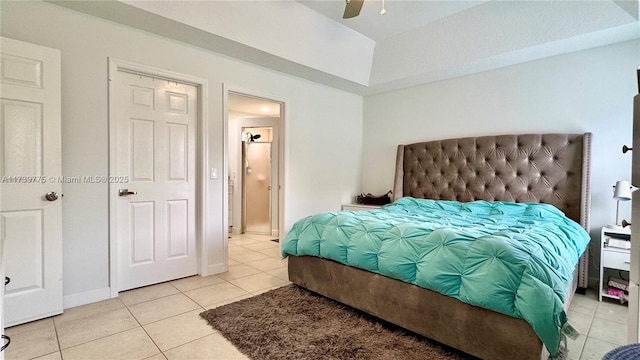 bedroom with ceiling fan and light tile patterned floors