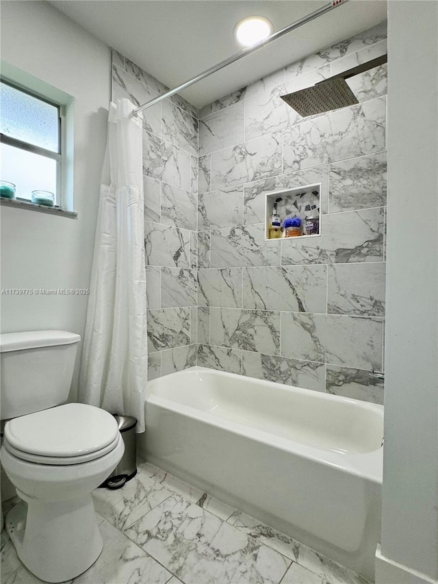 bathroom with toilet, shower / bath combo with shower curtain, and marble finish floor