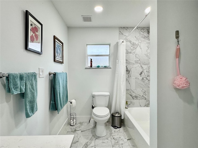 bathroom with shower / bath combination with curtain and toilet