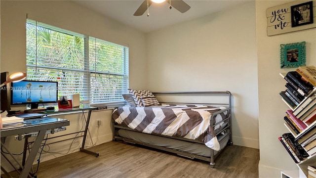 bedroom with hardwood / wood-style floors