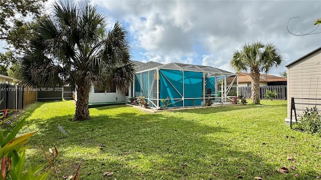 view of yard with glass enclosure