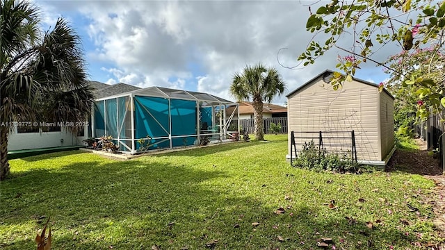 view of yard featuring glass enclosure and a storage shed