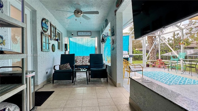 view of patio / terrace with ceiling fan and glass enclosure