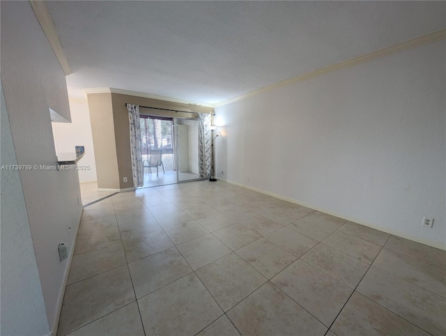 tiled spare room with ornamental molding