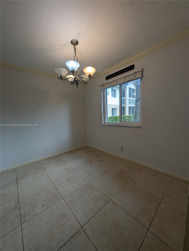 empty room with ornamental molding, a chandelier, light tile patterned flooring, and a textured ceiling