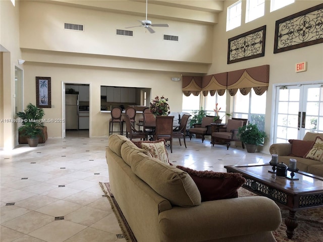 living room with light tile patterned flooring and ceiling fan