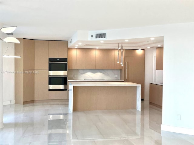 kitchen featuring stainless steel double oven, visible vents, light countertops, backsplash, and modern cabinets