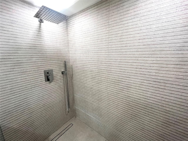 bathroom with tiled shower