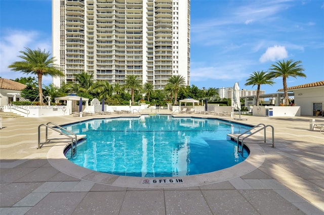 pool with a patio area