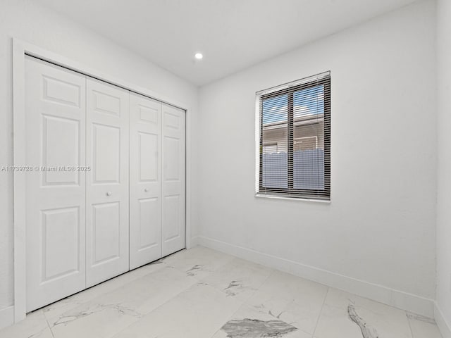 unfurnished bedroom with a closet