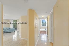 corridor with light tile patterned floors