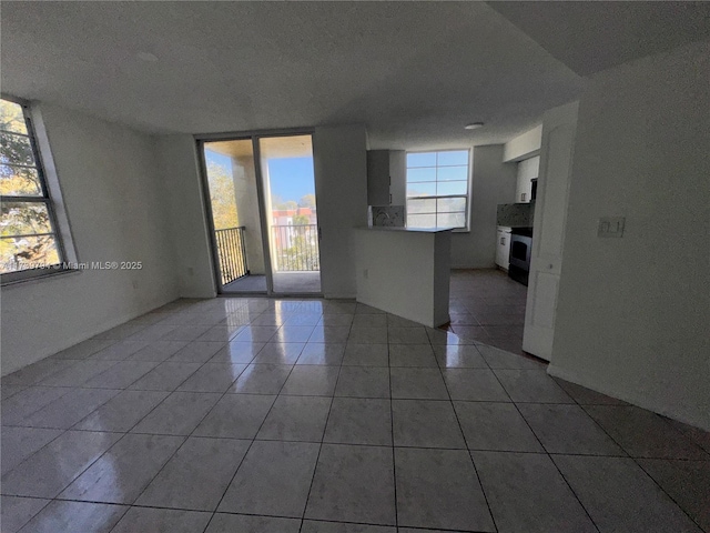 unfurnished room featuring tile patterned flooring