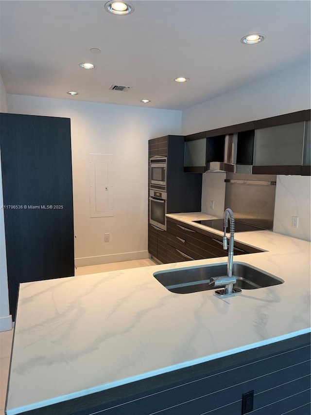 200 Biscayne Boulevard Way Unit 4904, Miami, FL 33131 - kitchen with appliances with stainless steel finishes, light stone counters, recessed lighting, modern cabinets, and electric panel