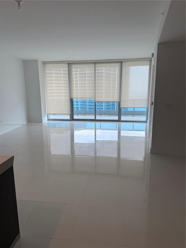 200 Biscayne Boulevard Way Unit 4904, Miami, FL 33131 - tiled spare room featuring floor to ceiling windows