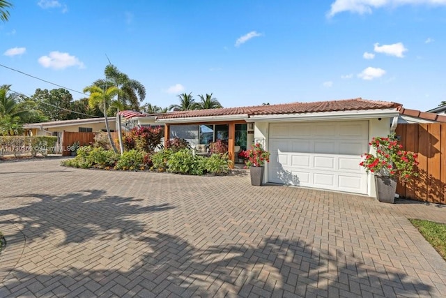 ranch-style house featuring a garage