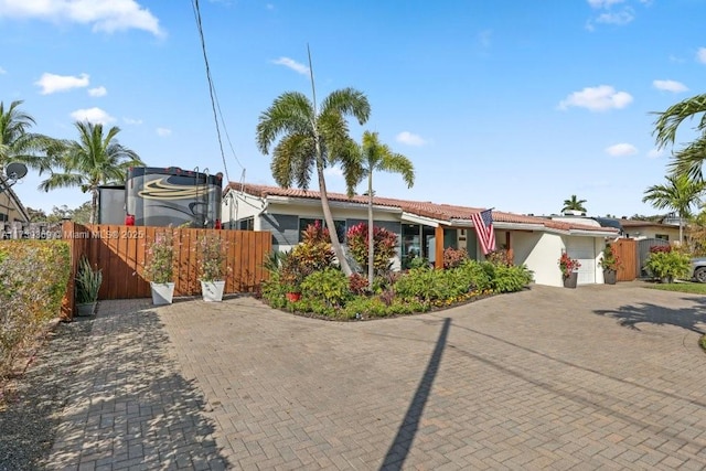 ranch-style home featuring a garage