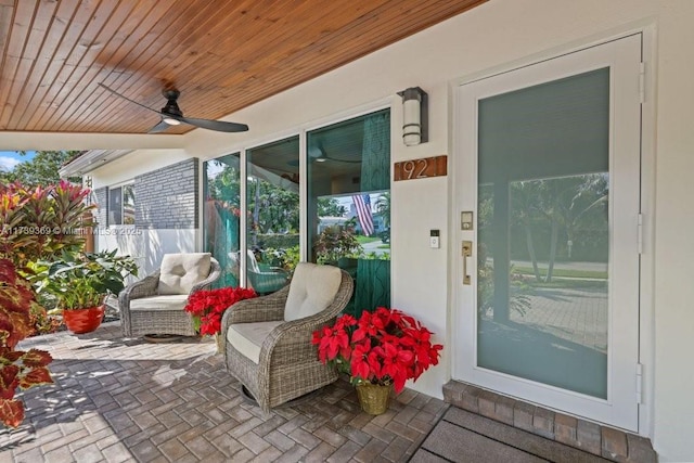 view of patio featuring ceiling fan