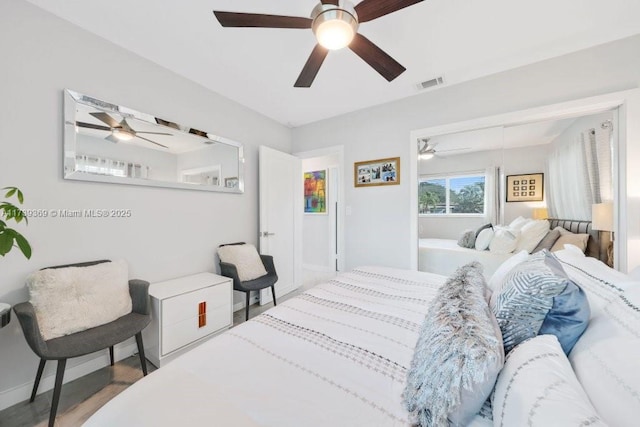 bedroom featuring hardwood / wood-style flooring and ceiling fan