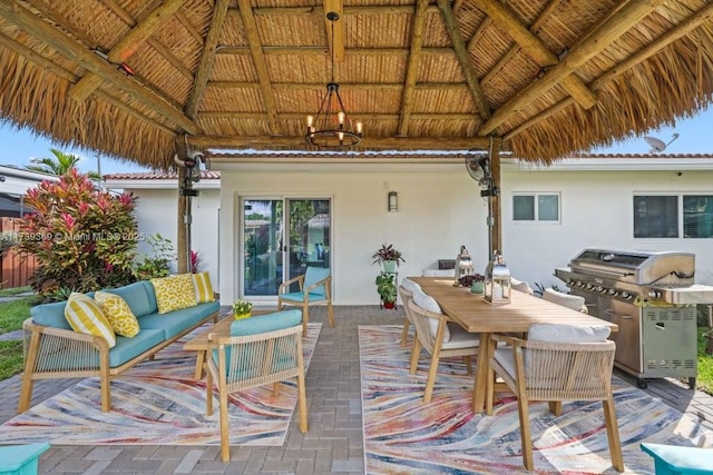 deck featuring a gazebo, grilling area, and an outdoor hangout area