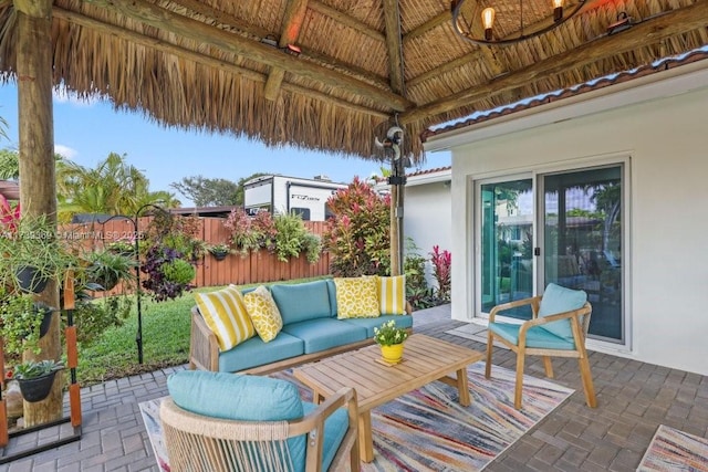 view of patio with a gazebo, outdoor lounge area, and ceiling fan