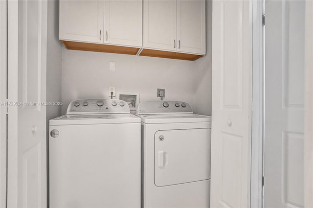 laundry area with cabinets and separate washer and dryer