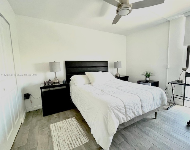 bedroom featuring ceiling fan and hardwood / wood-style floors