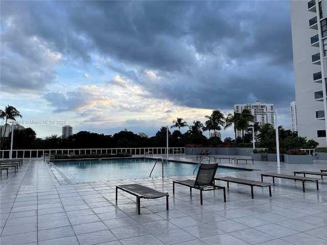 view of swimming pool featuring a patio area