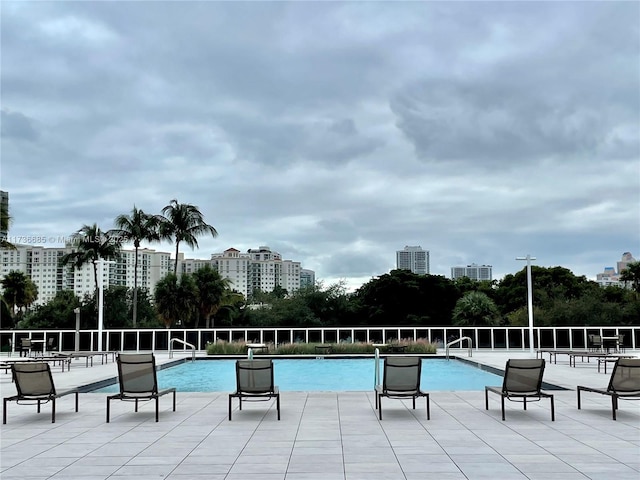 view of swimming pool featuring a patio area